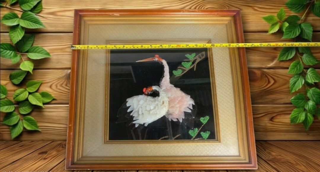 Framed Crane Artwork - Unique 3D Textured Piece (Category: Frames & Pictures) located in Naga. Submitted by solamia (Listing ID 1448596036, Image 2). Description: - Stunning framed artwork featuring two elegant cranes. - Cranes have a unique 3D effect due to textured, layered material. - Deep black background with a natural branch and vibrant green leaves. - Elegant wooden frame with a classic gold trim. - Generous size: approximately 20 inches b