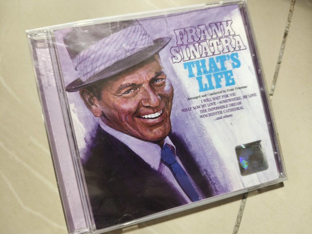Frank Sinatra That's Life CD (Category: CDs & DVDs) located in Kuala Lumpur. Submitted by kuchinghitam (Listing ID 1448635713, Image 1). Description: - Classic Frank Sinatra album: 'That's Life' - Features popular tracks: 'I Will Wait For You', 'Somewhere My Love', 'Winchester Cathedral' - Arranged and conducted by the renowned Ernie Freeman - Perfect addition to any music lover's collection - Own a piece of musical history! Price RM25.