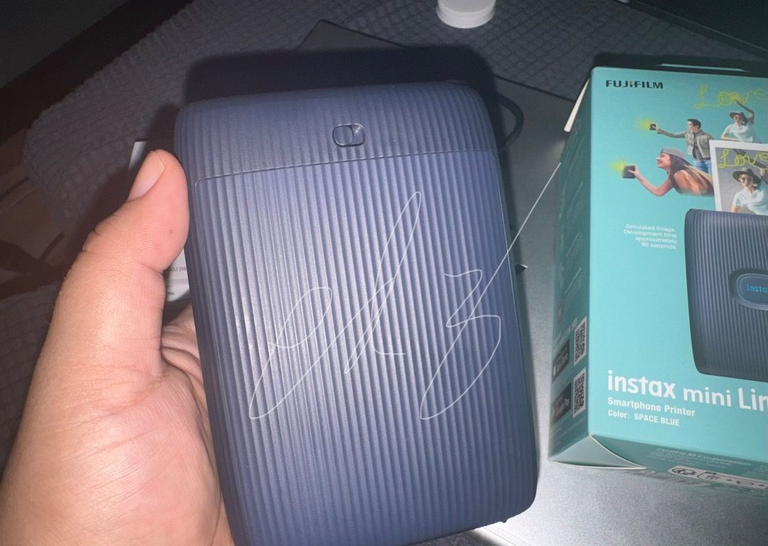 Fujifilm Instax mini Link 2 (Category: Camera Bags & Carriers) located in Makati City. Submitted by everydayedz (Listing ID 1448687280, Image 3). Description: Fujifilm Instax mini Link 2 Bought last March 2024 for 7,299 Selling for 4,900 Sobrang bihira nagamit kaya like new Unit only, box and usb charger NO FILM Rfs: di nagagamit Loc Comembo Taguig J&t or Lalalmove sf/df shoulder by buyer.
