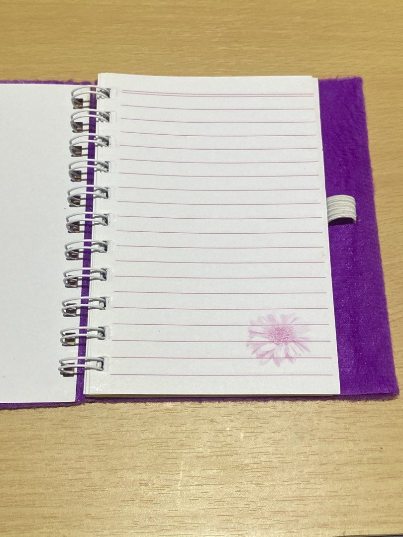 Fuzzy Purple Notebook with Flower Design (Category: Stationery & School Supplies) located in Dasmarinas. Submitted by ae.decluttering (Listing ID 1448601078, Image 2). Description: - Cute fuzzy purple notebook - Flower design on the front cover - Spiral bound - Lined pages inside - Elastic band closure - Ideal for notes or diary - No pen included .
