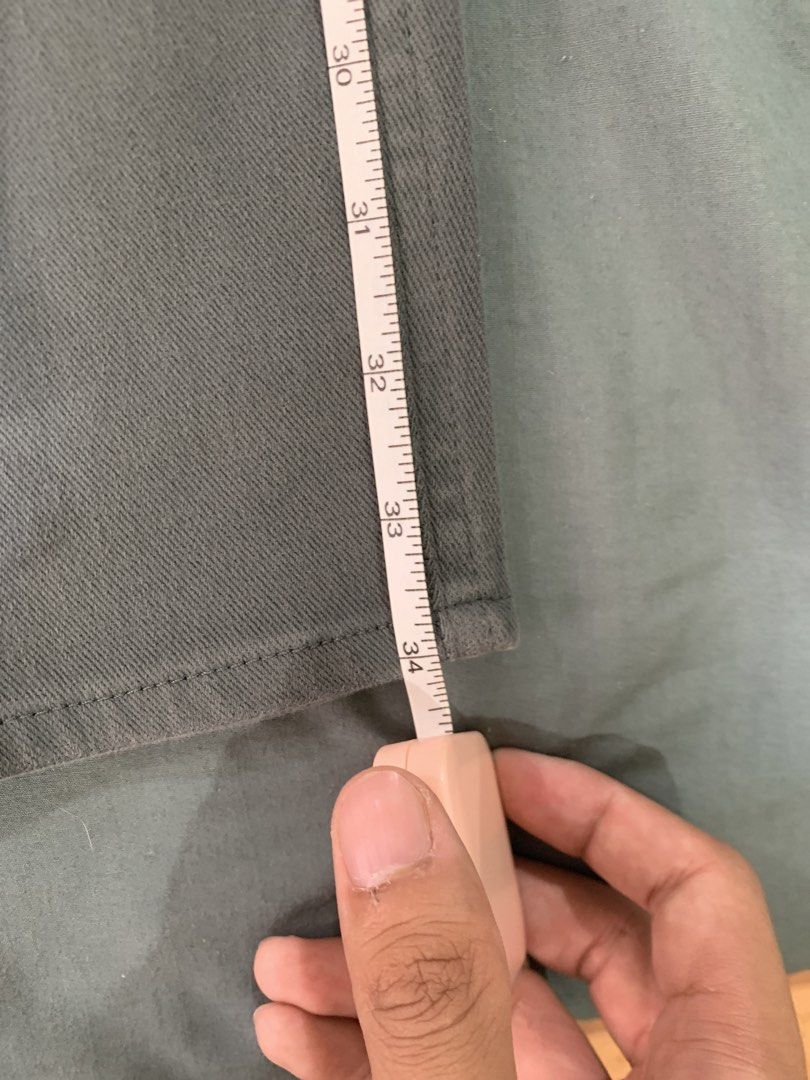 Green Jeans (Category: Other Bottoms) located in Binan City. Submitted by bentenison (Listing ID 1448566668, Image 2). Description: - Green trousers - Straight leg fit - Button closure waistband - Perfect for casual wear - Measurements available in photos.