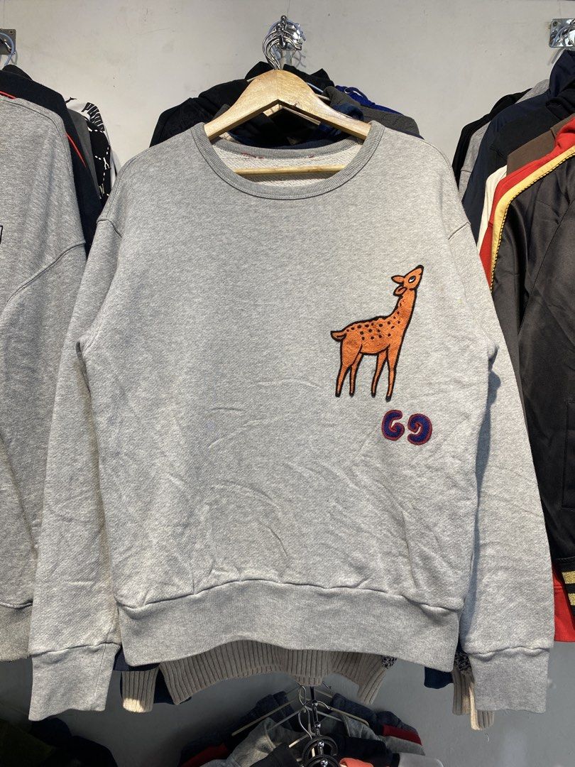 Gucci Grey Deer & '69' Patch Sweatshirt Size S (Category: Luxury Apparel) located in Manila. Submitted by johncedric75522 (Listing ID 1448564981, Image 1). Description: - Authentic Grey Gucci Sweatshirt - Size: S - Features a charming deer patch with '69' detail on the front - Made in Italy - A unique addition to your designer collection.