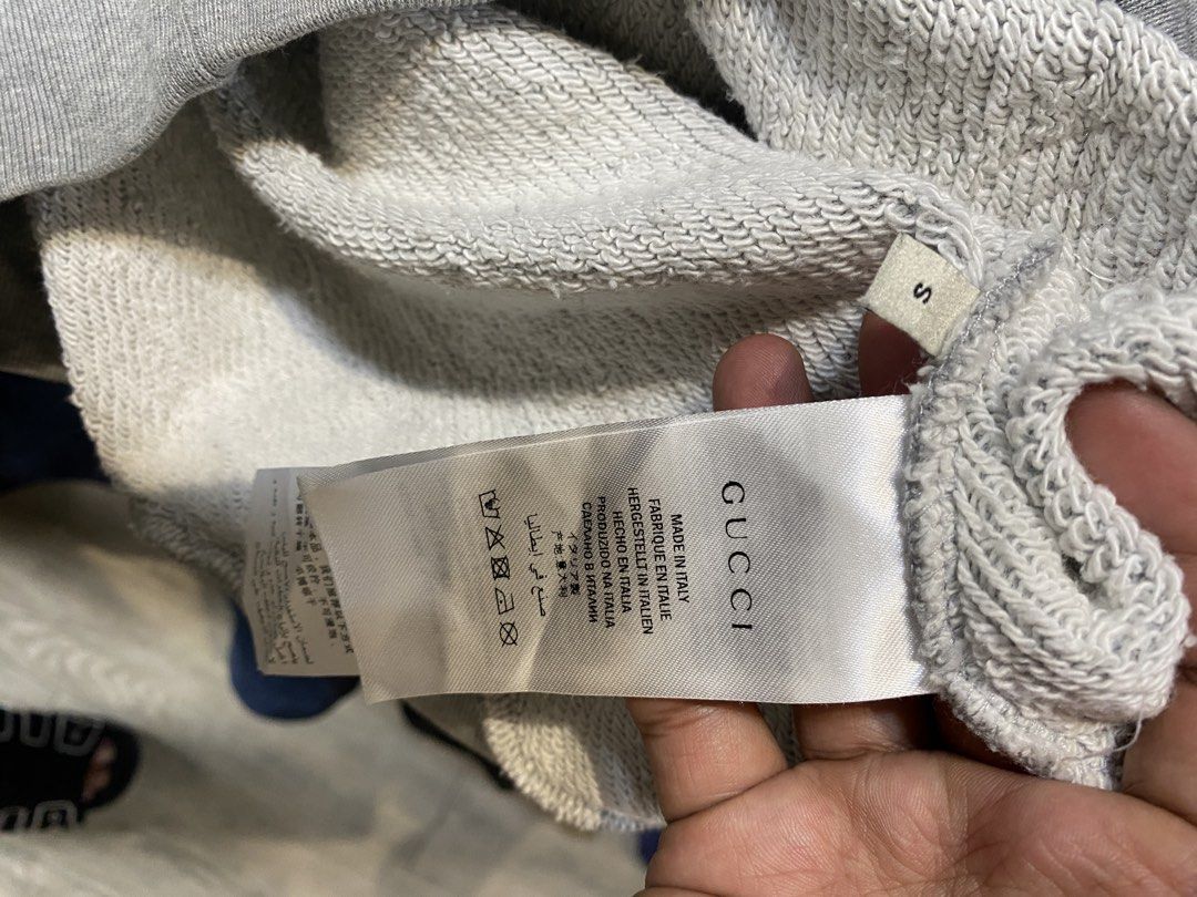 Gucci Grey Deer & '69' Patch Sweatshirt Size S (Category: Luxury Apparel) located in Manila. Submitted by johncedric75522 (Listing ID 1448564981, Image 2). Description: - Authentic Grey Gucci Sweatshirt - Size: S - Features a charming deer patch with '69' detail on the front - Made in Italy - A unique addition to your designer collection.