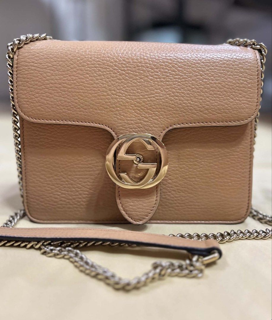 Gucci Interlocking Shoulder bag (Category: Luxury Bags & Wallets) located in Calamba. Submitted by shopexpress247 (Listing ID 1448677106, Image 1). Description: - Authentic Gucci Interlocking Bag in Beige color, Calfskin leather and Light Gold hardware -Adjustable chain strap -Includes: Original dust bag, coa (legit grails), cards, paperbag.