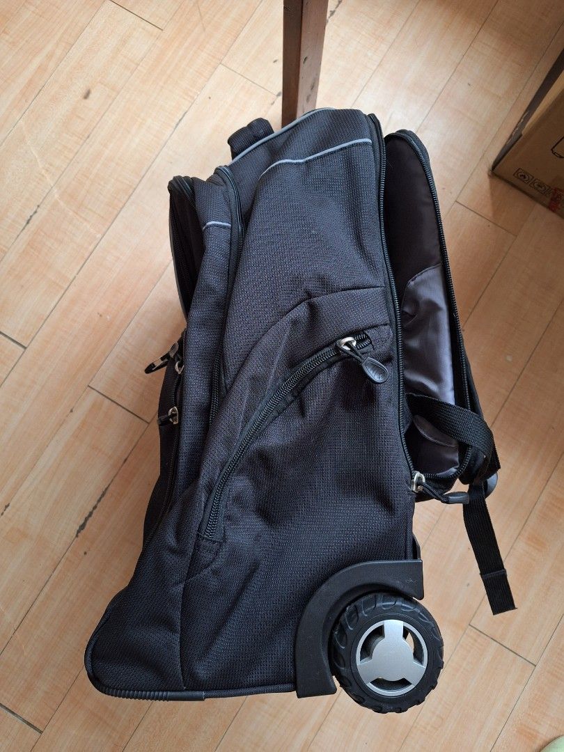 High Sierra Powerglide Wheeled Backpack (Category: Backpacks) located in Iloilo. Submitted by declutterbuddy08 (Listing ID 1448559055, Image 2). Description: - Black High Sierra rolling backpack - Features wheels and a retractable handle for easy transport - Multiple compartments and pockets for excellent organization - Includes padded shoulder straps for comfortable carrying - Ideal for travel or school use.