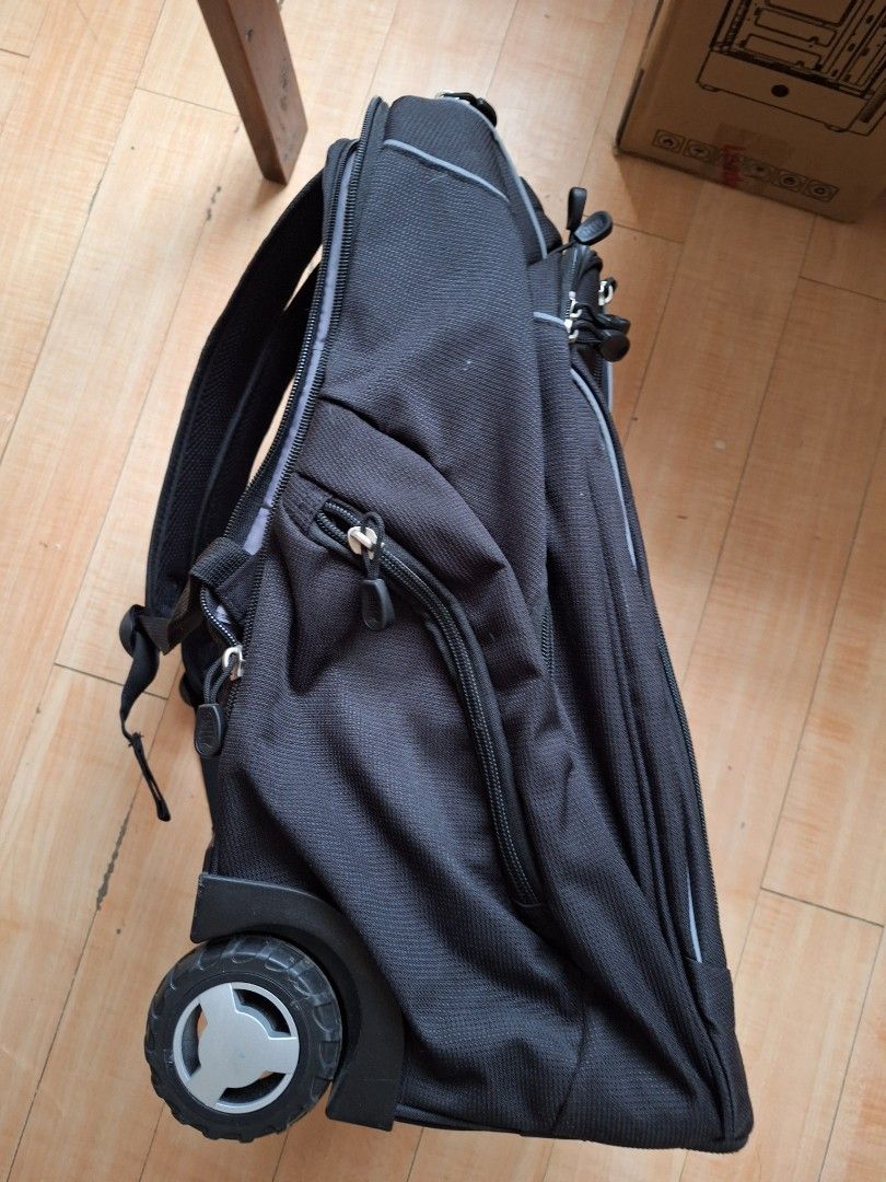 High Sierra Powerglide Wheeled Backpack (Category: Backpacks) located in Iloilo. Submitted by declutterbuddy08 (Listing ID 1448559055, Image 3). Description: - Black High Sierra rolling backpack - Features wheels and a retractable handle for easy transport - Multiple compartments and pockets for excellent organization - Includes padded shoulder straps for comfortable carrying - Ideal for travel or school use.