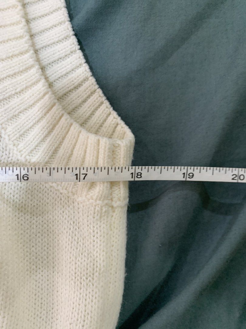 H&M Divided Cream Cable Knit Sweater Vest (Category: Sleeveless) located in Binan City. Submitted by bentenison (Listing ID 1448564528, Image 2). Description: - Cream cable knit sweater vest - Brand: H&M Divided - Size: L - Approx. Length: 18 inches - Approx. Width: 19 inches - Cozy knit material - Versatile for layering over shirts or wearing solo.