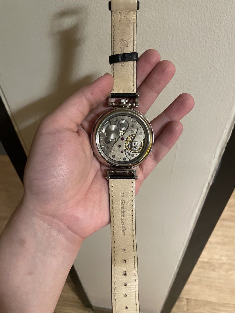 IWC Schaffhausen Pocket Watch Conversion Wristwatch (Category: Men's Watches) located in Agdangan. Submitted by kikayfindsph (Listing ID 1448658937, Image 3). Description: A vintage IWC Schaffhausen dress watch featuring a striking oversized round stainless-steel case and an elegant white/silver mother-of-pearl-style textured dial. The dial is accented with classic black Arabic numerals, a red 12, red minute-track markings, elegant blued/black ha