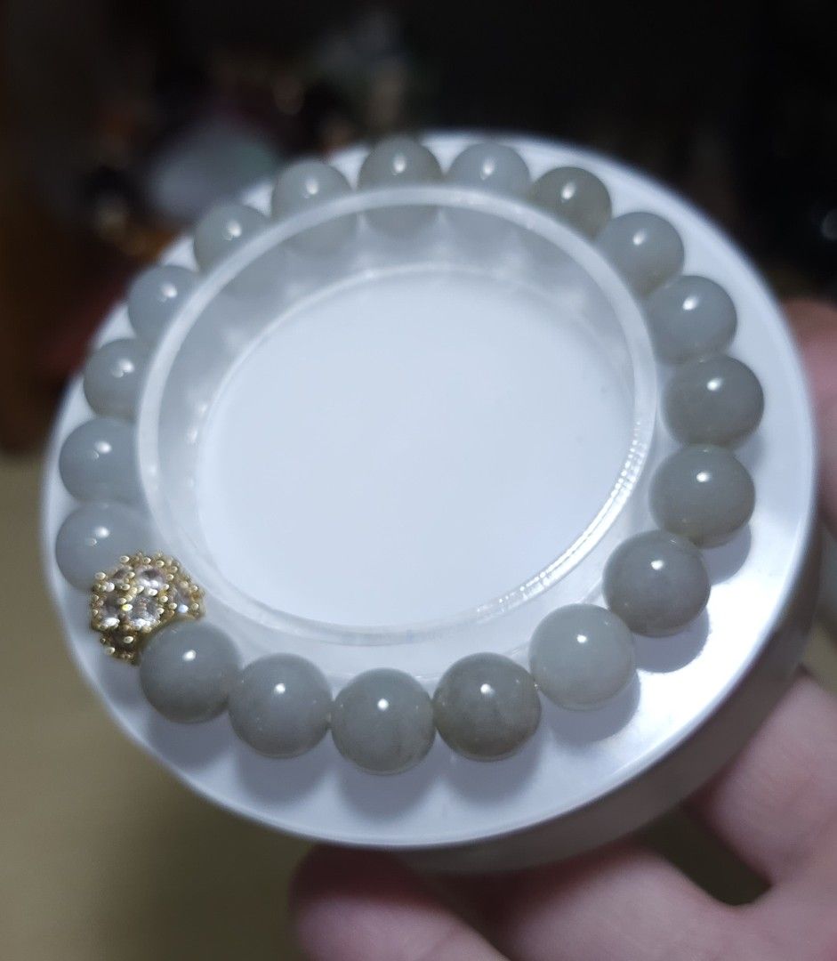 Jadeite Bracelet with Gold-Plated Charm (Category: Bracelets) located in Batangas. Submitted by finestonesandfindsph (Listing ID 1448524000, Image 3). Description: - Genuine natural light yellow jadeite beads - Stretchy bracelet for easy wear - Features a sparkly gold-plated charm with small stones - Versatile for everyday or special occasions - Complements various outfits - A beautiful addition to your jewelry collection.