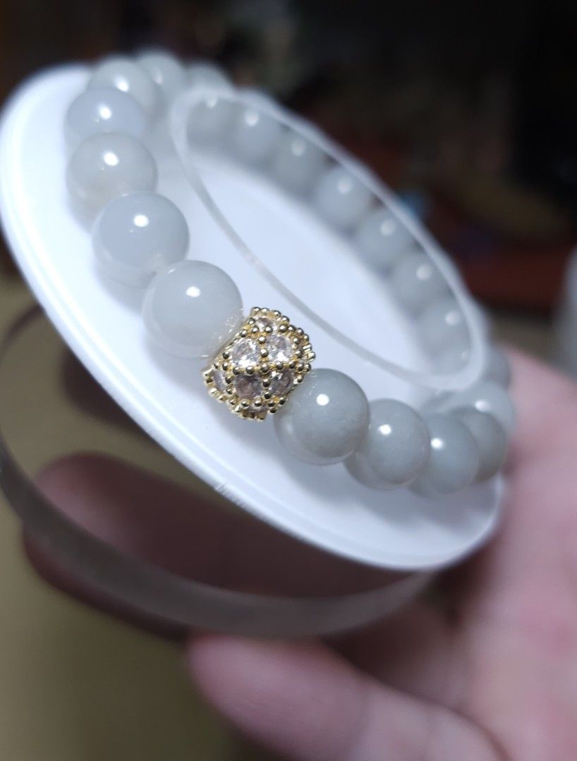 Jadeite Bracelet with Gold-Plated Charm (Category: Bracelets) located in Batangas. Submitted by finestonesandfindsph (Listing ID 1448524000, Image 2). Description: - Genuine natural light yellow jadeite beads - Stretchy bracelet for easy wear - Features a sparkly gold-plated charm with small stones - Versatile for everyday or special occasions - Complements various outfits - A beautiful addition to your jewelry collection.