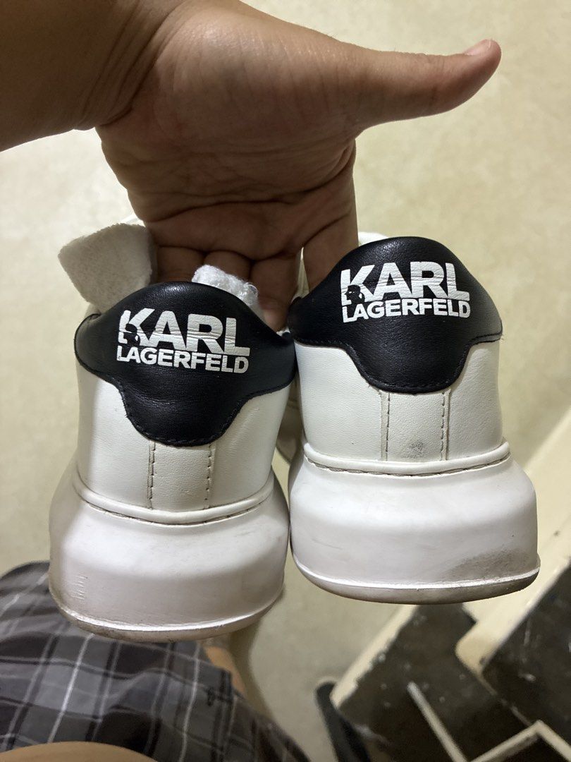 Karl Lagerfeld White Leather Sneakers with Charm (Category: Sneakers) located in San Pedro. Submitted by kendrickkiff2023 (Listing ID 1448639883, Image 3). Description: - Authentic Karl Lagerfeld white leather sneakers - Features iconic Karl Lagerfeld character charm on the side - "Karl Lagerfeld" printed on the sole - Stylish black heel detail - Secure lace-up closure - Ideal for everyday casual wear Size 8 mens.