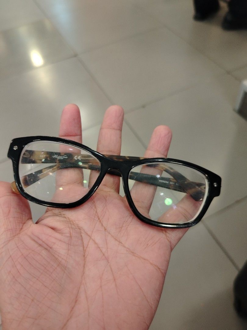 Kenneth Cole New York Eyeglasses Black Tortoise Shell Frames (Category: Sunglasses & Eyewear) located in Manila. Submitted by purediamond888 (Listing ID 1448576011, Image 2). Description: - Brand: Kenneth Cole New York - Frame Color: Black with Tortoise Shell Arms - Shape: Classic Rectangular - Condition: Lenses are clear and ready for prescription - Style: Perfect for everyday wear, a stylish accessory.