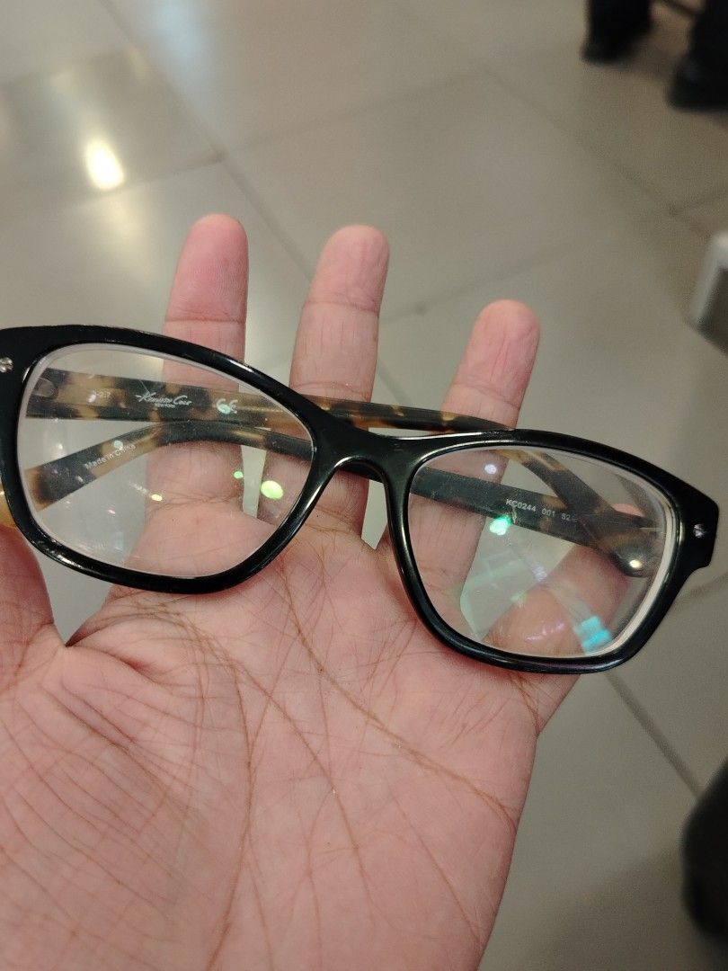 Kenneth Cole New York Eyeglasses Black Tortoise Shell Frames (Category: Sunglasses & Eyewear) located in Manila. Submitted by purediamond888 (Listing ID 1448576011, Image 1). Description: - Brand: Kenneth Cole New York - Frame Color: Black with Tortoise Shell Arms - Shape: Classic Rectangular - Condition: Lenses are clear and ready for prescription - Style: Perfect for everyday wear, a stylish accessory.