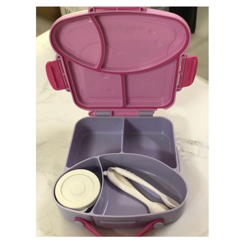 Kids Bento Lunch Box with Utensils and Container (Category: Weaning & Toddler Feeding) located in Makati City. Submitted by luckymoon_065c27 (Listing ID 1448552780, Image 1). Description: - Adorable pink and purple bento lunch box, perfect for kids. - Multiple compartments to keep food separate and organized. - Includes a convenient small container with a lid. - Comes with a set of utensils for easy eating. - Features easy-to-use latches for simp