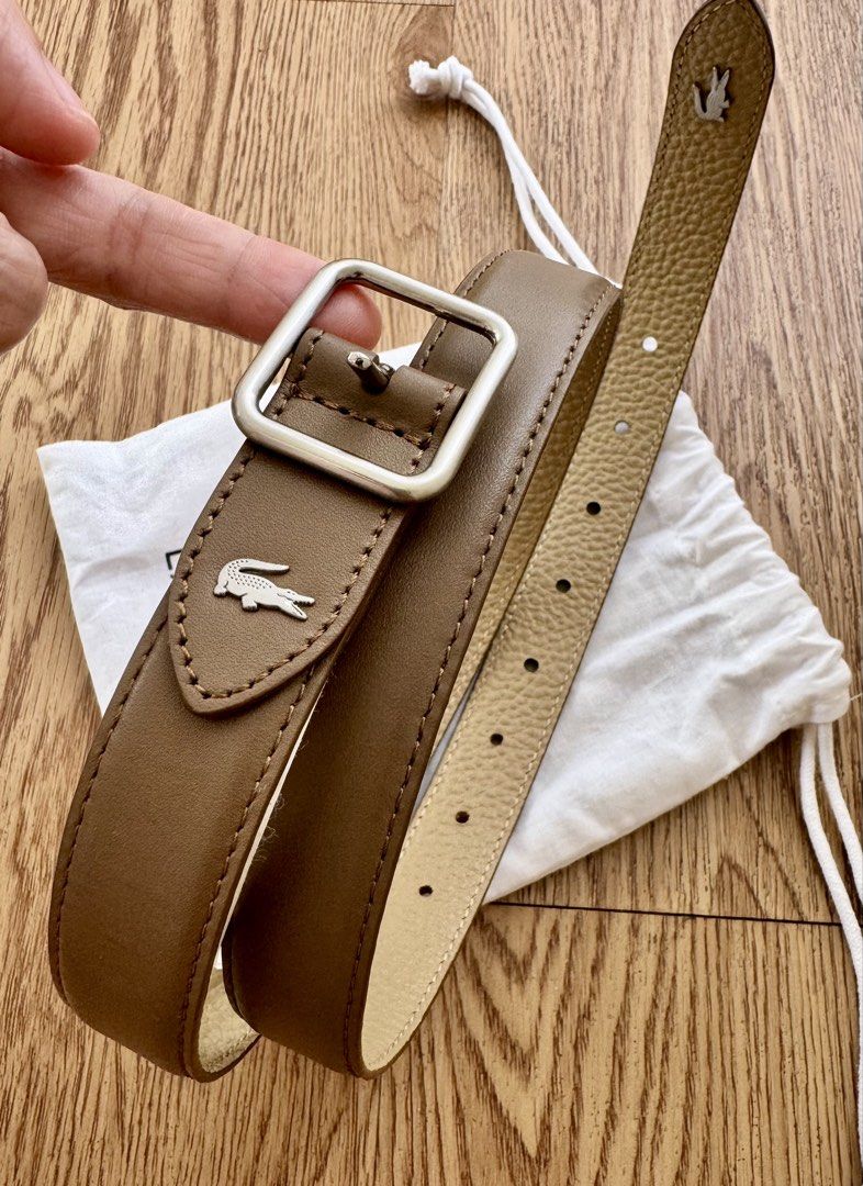 Lacoste Leather REVERSIBLE Belt with Silver Buckle (Category: Belts) located in Quezon City. Submitted by lc_ac (Listing ID 1448519315, Image 2). Description: - Genuine Lacoste brown leather belt - Features iconic crocodile logo on strap - Silver square buckle - Comes with original dust bag - Belt size: 3 - Perfect accessory to elevate any outfit.