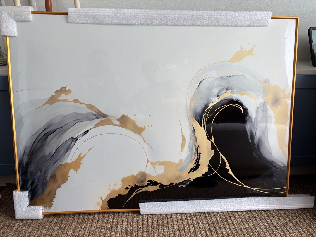 Large Abstract Gold and Black Framed Wall Art (Category: Frames & Pictures) located in Mandaluyong City. Submitted by carol_0368 (Listing ID 1448535813, Image 1). Description: - Beautiful abstract art piece - Features swirling gold, black, and grey tones - Comes in a sleek gold frame - Adds a modern touch to any room - Ready to hang - Dimensions: 70x100cm RFS:Wrong Size.