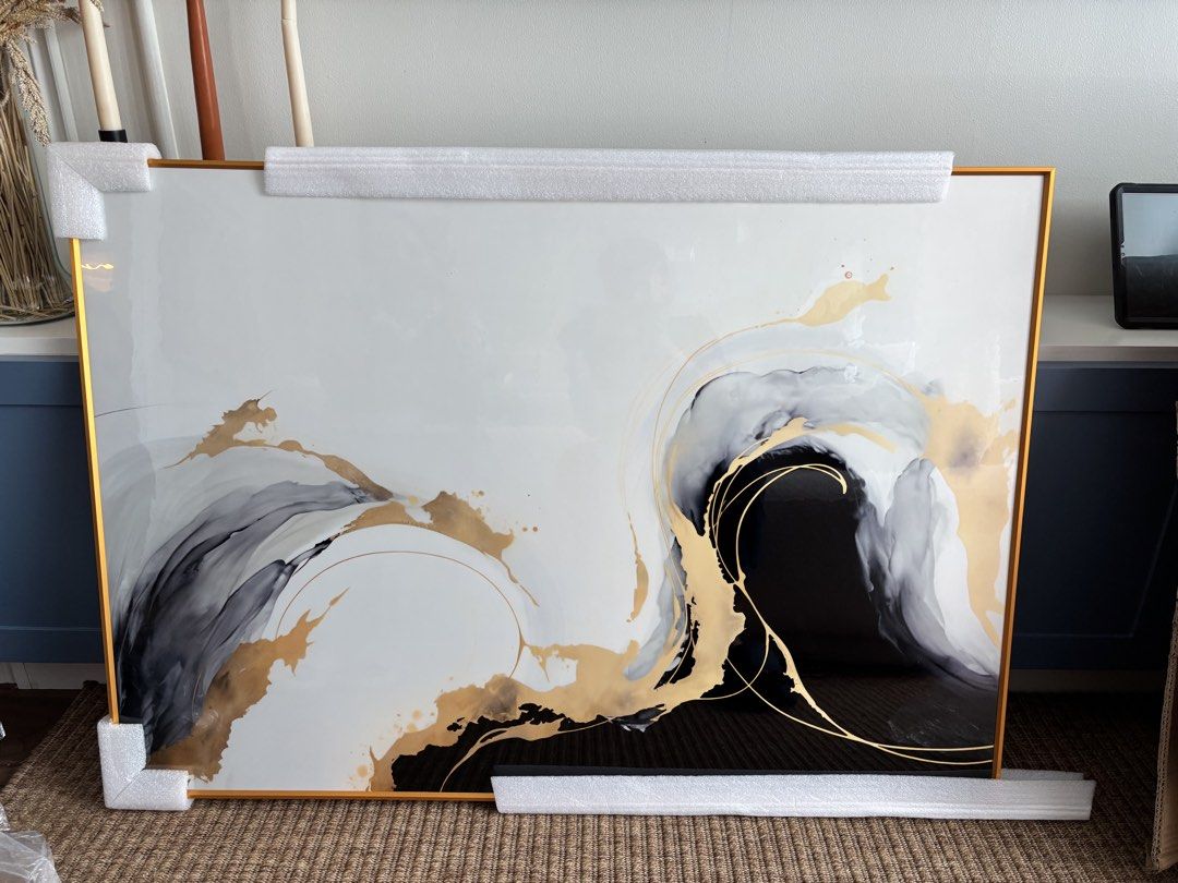 Large Abstract Gold and Black Framed Wall Art (Category: Frames & Pictures) located in Mandaluyong City. Submitted by carol_0368 (Listing ID 1448535813, Image 2). Description: - Beautiful abstract art piece - Features swirling gold, black, and grey tones - Comes in a sleek gold frame - Adds a modern touch to any room - Ready to hang - Dimensions: 70x100cm RFS:Wrong Size.