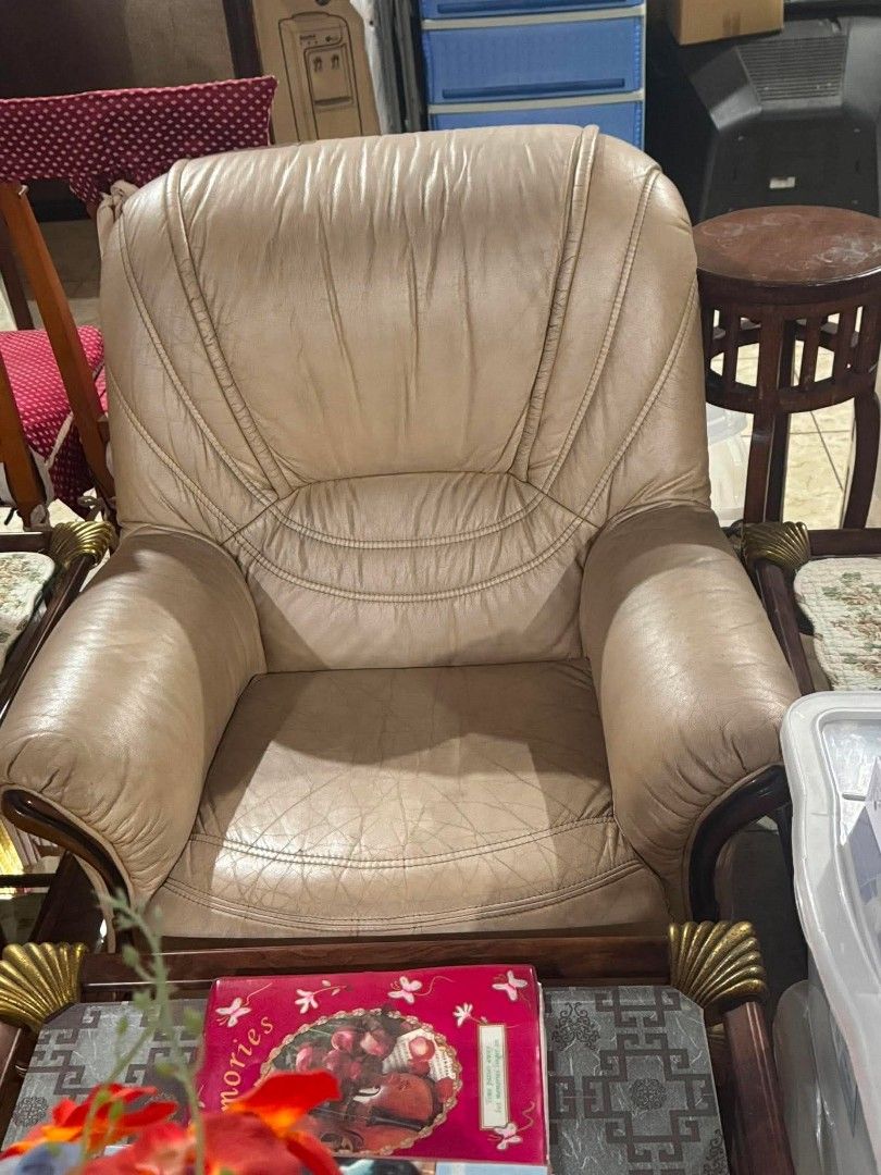 Leather Sofa Set with Center Glass Table (Category: Sofas) located in Manila. Submitted by jezm. (Listing ID 1448580072, Image 2). Description: - Genuine leather 3-seater sofa - Genuine leather 1-seater armchair - Detailed wood trim on sofa and armchair - Glass top coffee table - Wooden frame with gold accents on coffee table - Ideal for living room setup - Pick up only.