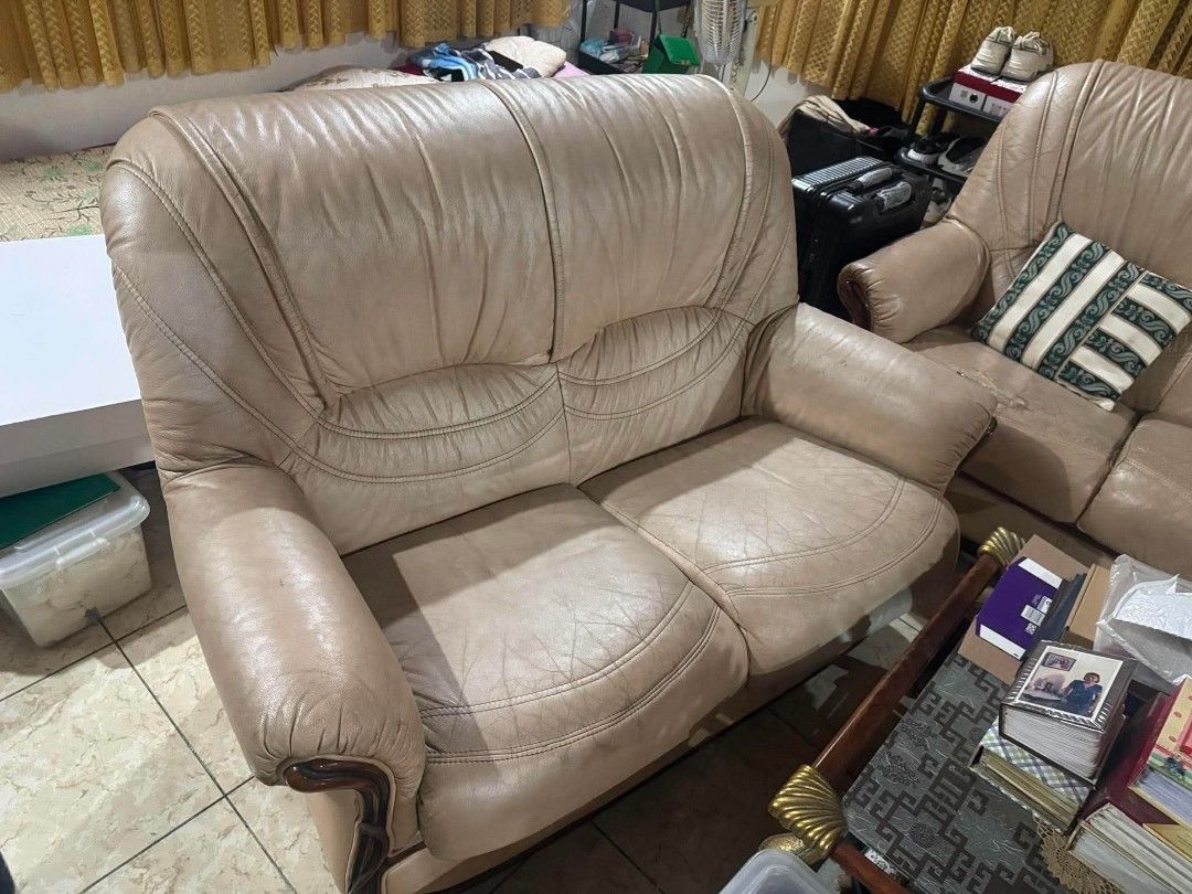 Leather Sofa Set with Center Glass Table (Category: Sofas) located in Manila. Submitted by jezm. (Listing ID 1448580072, Image 3). Description: - Genuine leather 3-seater sofa - Genuine leather 1-seater armchair - Detailed wood trim on sofa and armchair - Glass top coffee table - Wooden frame with gold accents on coffee table - Ideal for living room setup - Pick up only.