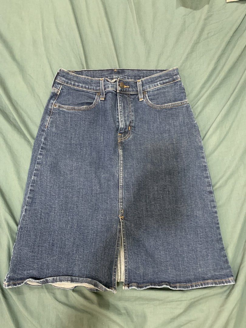 Levi's Denim Midi Skirt - Size 26 (Category: Skirts) located in Binan City. Submitted by bentenison (Listing ID 1448569154, Image 1). Description: - Classic blue denim midi skirt by Levi's - Features a stylish front slit for ease of movement - Waistband measures 28 inches - Skirt length is approximately 23 inches - A versatile staple piece for any outfit.