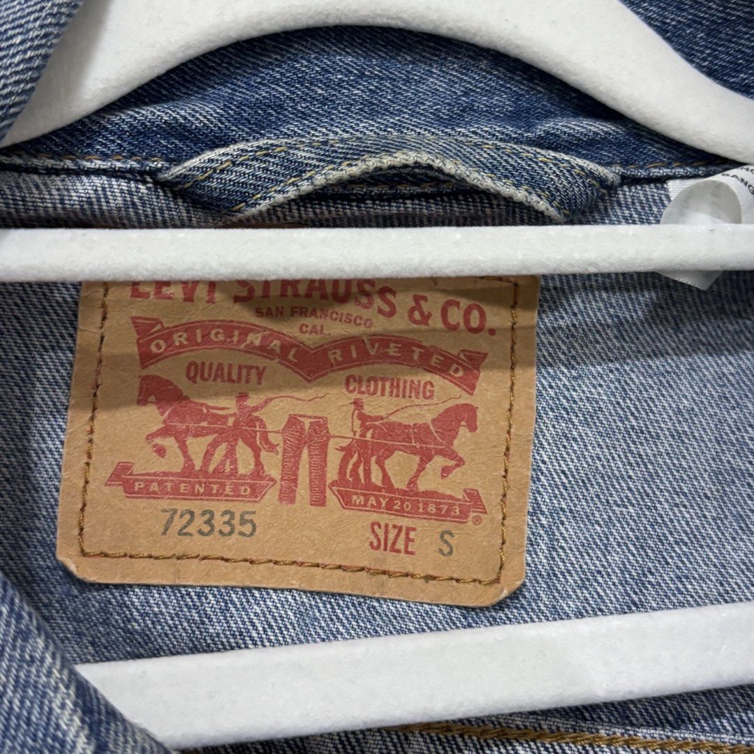 Levi's Type III Denim Jacket (Category: Coats, Jackets and Outerwear) located in Quezon City. Submitted by grailph (Listing ID 1448631054, Image 3). Description: - Classic blue denim trucker jacket from Levi's - Iconic red tab and branded buttons - Small on tag - 21”x24” Dimensions - Two chest pockets with button closures - TYPE III jacket - Made with durable denim - Versatile staple piece for any wardrobe Normal signs of usage Check last pic nor