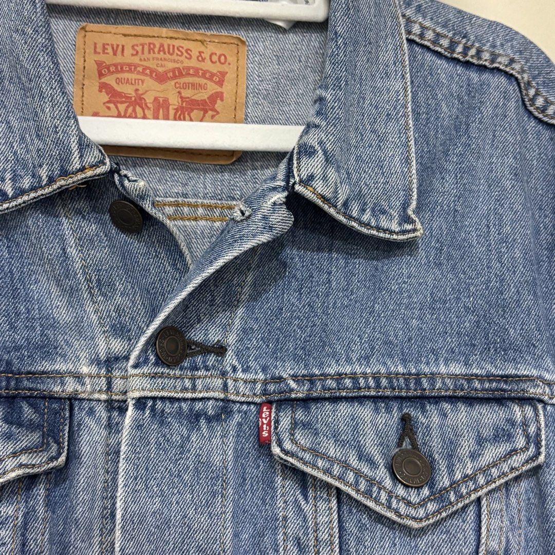 Levi's Type III Denim Jacket (Category: Coats, Jackets and Outerwear) located in Quezon City. Submitted by grailph (Listing ID 1448631054, Image 2). Description: - Classic blue denim trucker jacket from Levi's - Iconic red tab and branded buttons - Small on tag - 21”x24” Dimensions - Two chest pockets with button closures - TYPE III jacket - Made with durable denim - Versatile staple piece for any wardrobe Normal signs of usage Check last pic nor