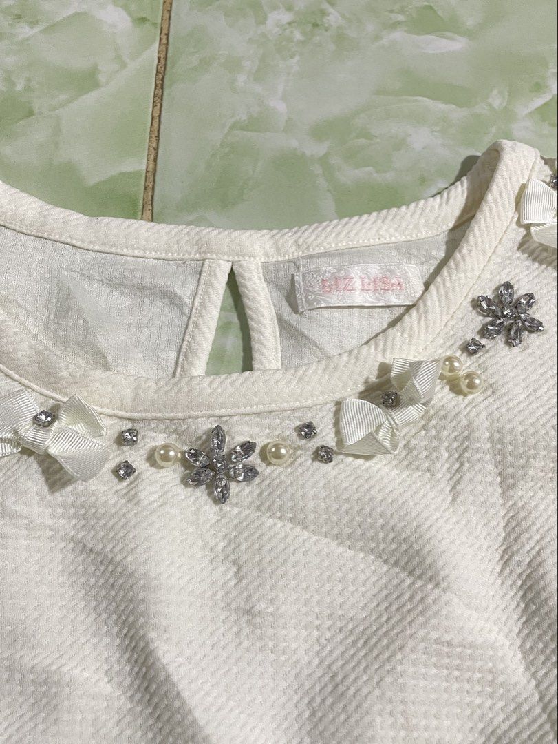 LIZ LISA ANGELIC BIG BOW TOP (Category: Blouses) located in Cagayan de Oro. Submitted by patrickjam03829 (Listing ID 1448630144, Image 3). Description: size small 16width 21.5 length.