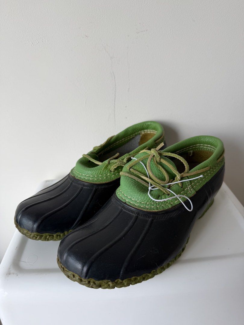 L.L. Bean Duck Boots Green Leather (Category: Boots) located in Kuala Lumpur. Submitted by dudewithstuff (Listing ID 1448542881, Image 1). Description: - Classic L.L. Bean duck boots - Black rubber lower with green leather uppers and laces - Made in Maine, USA - Perfect for rainy days or casual wear - Soles show some wear but have plenty of life left - Ready for your next adventure.