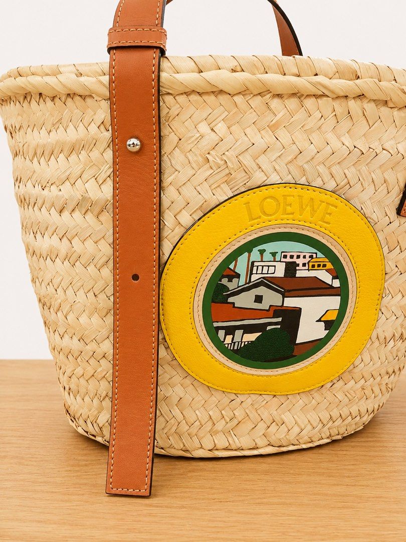 Loewe Basket Bag (Category: Luxury Bags & Wallets) located in Paranaque City. Submitted by katlouieleandicho (Listing ID 1448531314, Image 3). Description: Loewe x Ken Price L.A. Series Basket Bag Beautiful and highly collectible Loewe x Ken Price L.A. Series Basket Bag, handcrafted from natural woven palm leaf with luxurious calfskin leather handles and trim. The front features the signature Ken Price leather appliqué, making this a distinctive 