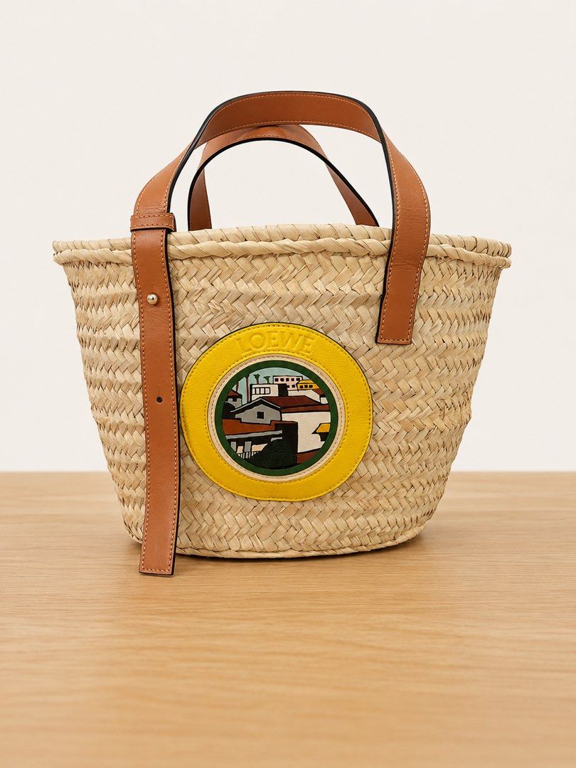 Loewe Basket Bag (Category: Luxury Bags & Wallets) located in Paranaque City. Submitted by katlouieleandicho (Listing ID 1448531314, Image 1). Description: Loewe x Ken Price L.A. Series Basket Bag Beautiful and highly collectible Loewe x Ken Price L.A. Series Basket Bag, handcrafted from natural woven palm leaf with luxurious calfskin leather handles and trim. The front features the signature Ken Price leather appliqué, making this a distinctive 