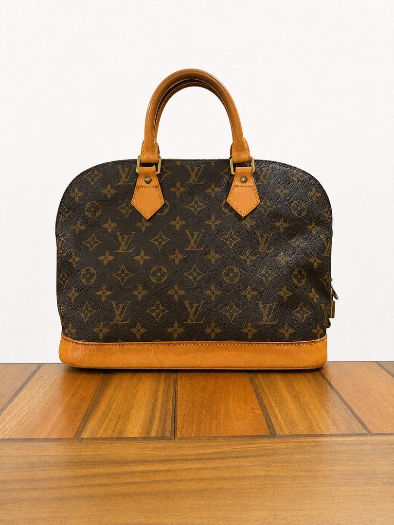 Louis Vuitton Alma Monogram (Category: Luxury Bags & Wallets) located in Paranaque City. Submitted by katlouieleandicho (Listing ID 1448594974, Image 3). Description: Louis Vuitton Alma PM Monogram Canvas Beautifully maintained Louis Vuitton Alma PM in iconic Monogram canvas. The canvas remains clean and vibrant, with sturdy handles, smooth zipper, and functional hardware. The vachetta leather has developed a lovely honey patina over time, giving