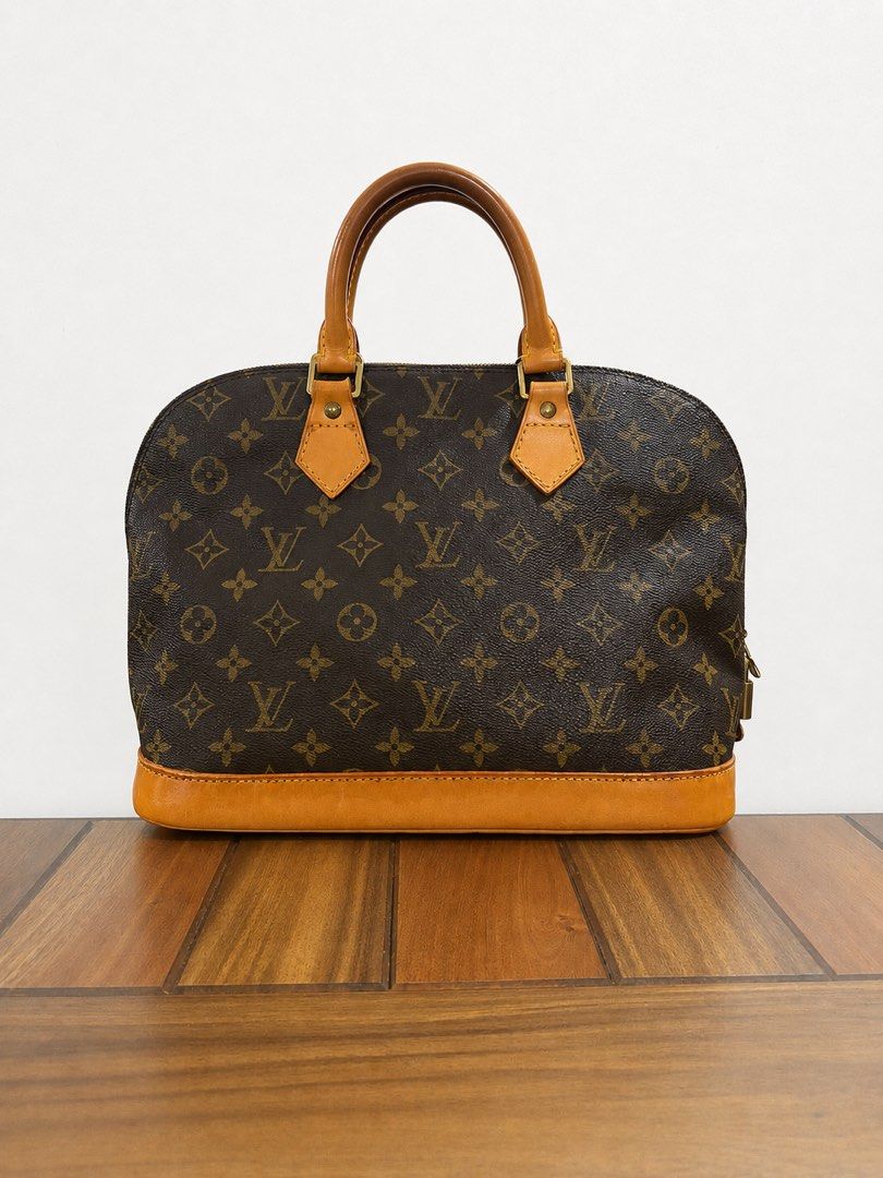 Louis Vuitton Alma Monogram (Category: Luxury Bags & Wallets) located in Paranaque City. Submitted by katlouieleandicho (Listing ID 1448594974, Image 2). Description: Louis Vuitton Alma PM Monogram Canvas Beautifully maintained Louis Vuitton Alma PM in iconic Monogram canvas. The canvas remains clean and vibrant, with sturdy handles, smooth zipper, and functional hardware. The vachetta leather has developed a lovely honey patina over time, giving