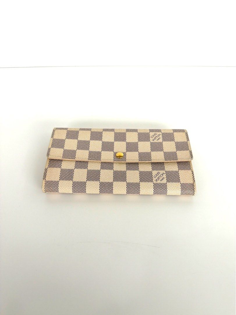 Authentic Louis Vuitton Damier Azur Wallet (Used) (Category: Luxury Bags & Wallets) located in Quezon City. Submitted by shoppingcartmnl (Listing ID 1448535708, Image 2). Description: - Authentic Louis Vuitton Wallet - Damier Azur Canvas - Snap Closure - Multiple Interior Card Slots - Zippered Coin Pocket - Made in Spain - Clean Interior and Exterior - Ideal for Everyday Use.