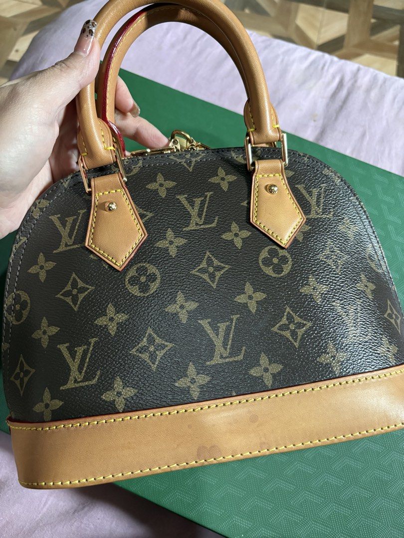 Louis Vuitton Monogram Alma BB Handbag (Category: Luxury Bags & Wallets) located in Quezon City. Submitted by gladystee (Listing ID 1448534592, Image 1). Description: - Classic Louis Vuitton Alma BB bag - Monogram canvas with vachetta leather trim - Gold hardware - Includes original lock and keys - Detachable strap for shoulder or crossbody wear - Ideal for daily use or special events - A timeless and iconic handbag - very well loved! .