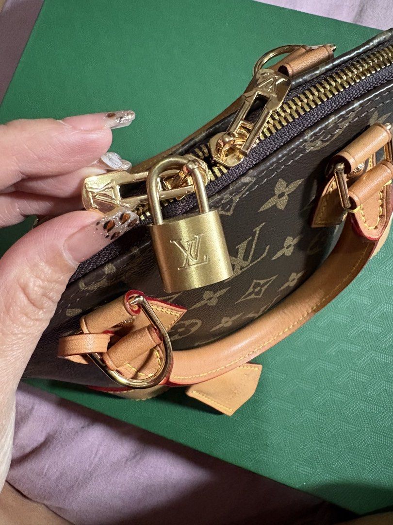 Louis Vuitton Monogram Alma BB Handbag (Category: Luxury Bags & Wallets) located in Quezon City. Submitted by gladystee (Listing ID 1448534592, Image 2). Description: - Classic Louis Vuitton Alma BB bag - Monogram canvas with vachetta leather trim - Gold hardware - Includes original lock and keys - Detachable strap for shoulder or crossbody wear - Ideal for daily use or special events - A timeless and iconic handbag - very well loved! .