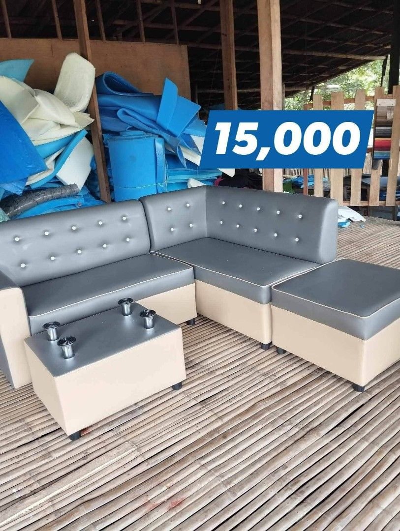 L-shaped sofa with ottoman and coffee table (Category: Sofas) located in Iloilo. Submitted by semicglinda (Listing ID 1448606074, Image 1). Description: - 4-piece L-shaped sofa set - Includes ottoman - Includes coffee table with metal legs - Upholstered in stylish grey and beige - Ideal for living rooms or lounges - Price: PHP 15,000.
