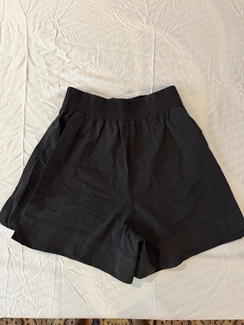 Lululemon Black High-Waisted Athletic Shorts (Category: Activewear) located in Taguig. Submitted by onein.oneout_declutter (Listing ID 1448590787, Image 2). Description: - Black Lululemon shorts - High-waisted with elasticated waistband - Side slits for enhanced movement - Ideal for workouts and casual wear - Made with comfortable and breathable fabric.