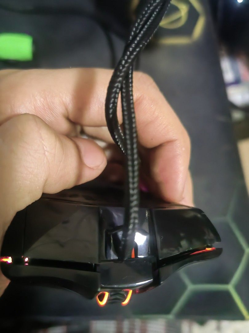 M808 STORM REDRAGON MOUSE (Category: Mouse & Mousepads) located in Angeles City. Submitted by ronaldfavored (Listing ID 1448623580, Image 2). Description: - Black gaming mouse with unique honeycomb design - Features vibrant RGB lighting effects - Wired USB connection for reliable performance - Works well, perfect for your gaming needs - Minor dust from normal use, doesn't affect functionality.