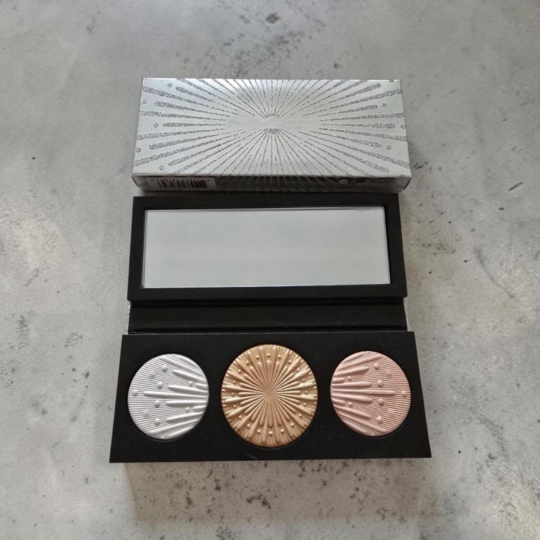 MAC Cosmetics Highlighter Palette - Limited Edition (Category: Makeup) located in Taguig. Submitted by altainfante (Listing ID 1448574884, Image 1). Description: - Limited edition MAC highlighter palette in Light version - Swatched only, comes with original box - Includes 3 versatile shades: Silver, Gold, and Rose Gold - Beautiful textured silver packaging with iconic MAC logo - Comes in a striking box with a sunburst design - Achieve a radiant, 