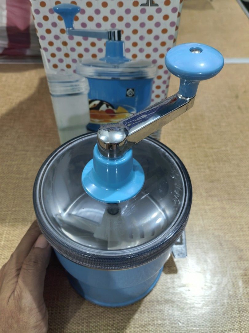 Manual Ice Cream Maker 1970s (Category: Other Kitchenware & Tableware) located in Cebu City. Submitted by dudes_villanueva (Listing ID 1448526643, Image 2). Description: Tiger Manual Ice Cream Maker 1970s Brand New. Old Stock Brand: Tiger 📌 It operates with a hand crank located on top to mix ingredients and includes a dispensing lever at the base..