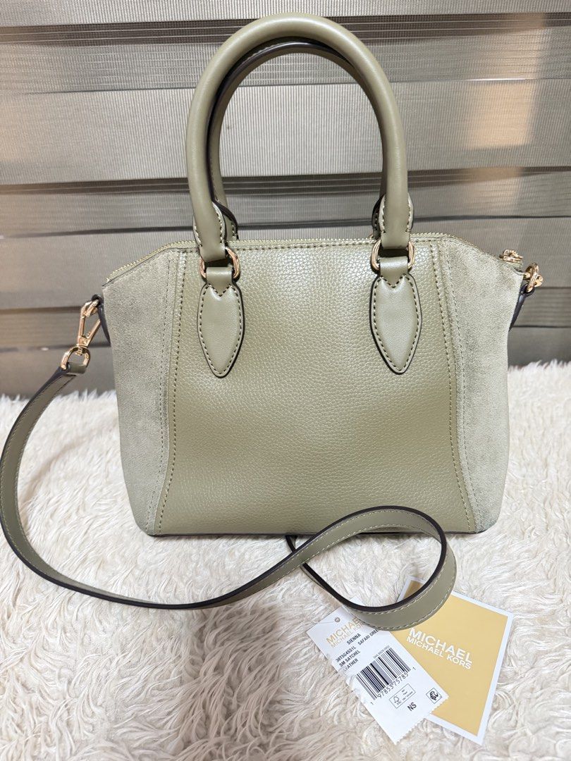 Michael Kors Satchel Bag - Olive Green (Category: Luxury Bags & Wallets) located in Pasig City. Submitted by pepay_c (Listing ID 1448564939, Image 2). Description: - Authentic Michael Kors satchel bag - Chic olive green color - Mix of pebbled leather and suede - Detachable crossbody strap included - Interior zip and slip pockets - Elegant gold hardware details - Comes with original tags.