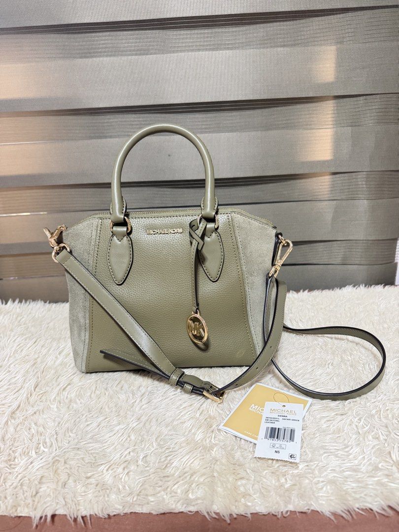 Michael Kors Satchel Bag - Olive Green (Category: Luxury Bags & Wallets) located in Pasig City. Submitted by pepay_c (Listing ID 1448564939, Image 1). Description: - Authentic Michael Kors satchel bag - Chic olive green color - Mix of pebbled leather and suede - Detachable crossbody strap included - Interior zip and slip pockets - Elegant gold hardware details - Comes with original tags.