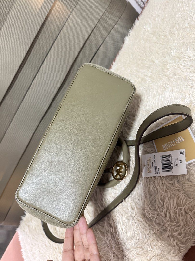 Michael Kors Satchel Bag - Olive Green (Category: Luxury Bags & Wallets) located in Pasig City. Submitted by pepay_c (Listing ID 1448564939, Image 3). Description: - Authentic Michael Kors satchel bag - Chic olive green color - Mix of pebbled leather and suede - Detachable crossbody strap included - Interior zip and slip pockets - Elegant gold hardware details - Comes with original tags.