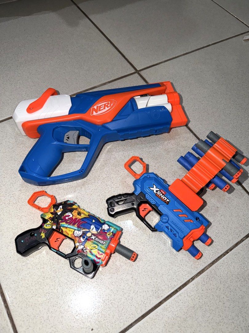Nerf and X-Shot Toy Guns Bundle (Category: Action & Battle Toys) located in Antipolo. Submitted by kzees (Listing ID 1448491413, Image 1). Description: - Rarely used - All original - Not complete na yung darts. Buy na lang po kayo hehe - Bundle includes 3 toy blasters (1 Nerf blaster & 2 X-Shot blasters) - One X-Shot features a Sonic the Hedgehog design What you see is what you get..