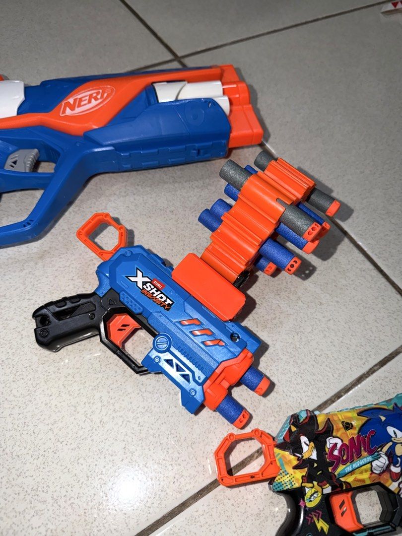 Nerf and X-Shot Toy Guns Bundle (Category: Action & Battle Toys) located in Antipolo. Submitted by kzees (Listing ID 1448491413, Image 3). Description: - Rarely used - All original - Not complete na yung darts. Buy na lang po kayo hehe - Bundle includes 3 toy blasters (1 Nerf blaster & 2 X-Shot blasters) - One X-Shot features a Sonic the Hedgehog design What you see is what you get..