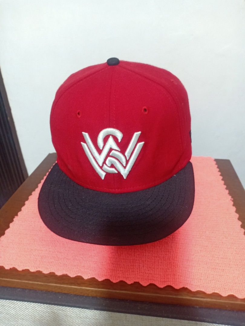 New Era Western Wanderers Red Black Snapback Cap (Category: Caps & Hats) located in Santa Rosa. Submitted by abj_104 (Listing ID 1448584860, Image 1). Description: - Western Wanderers snapback cap - Red crown with black brim - White embroidered Western Wanderers logo on front - New Era logo on the side - 'Western Wanderers' text embroidered on the back.