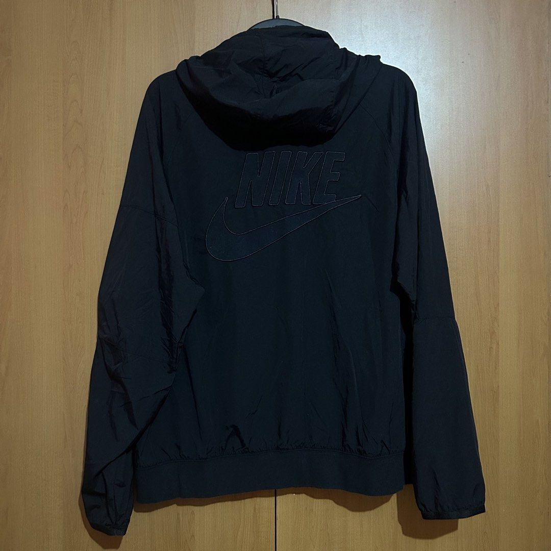 Nike Black Half Zip Track Jacket (Category: Coats, Jackets and Outerwear) located in Mandaluyong City. Submitted by vwonu (Listing ID 1448626377, Image 2). Description: -Width 23 -Length 27 - Black Nike anorak jacket - Hooded design - Half-zip closure - Lightweight material - Front pockets - Side zippered pocket - Small Nike logo on front - Large embossed Nike logo on back - Ideal for casual wear or sports.