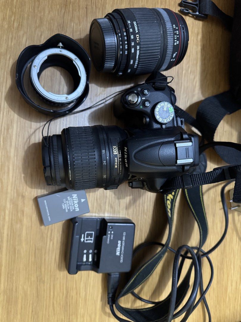 Nikon D5000 DSLR Camera with Sigma Lens and Accessories (Category: Cameras) located in Quezon City. Submitted by elektra0111 (Listing ID 1448651783, Image 3). Description: - Nikon D5000 DSLR Camera - Sigma DG 55-200mm Lens - Nikon-NEX Adapter - Nikon EN-EL3 Battery - Battery Charger - Ready for your photography adventures! - needs cleaning.