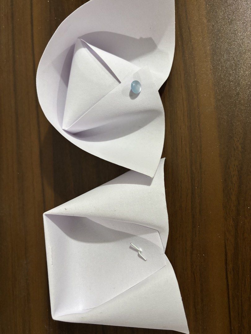 Nursing cal (Category: Medical Supplies & Tools) located in Manila. Submitted by rosel2001 (Listing ID 1448535228, Image 1). Description: - Handmade paper nursing call accessory - Features a unique folded paper design - Adorned with a light blue bead - Perfect for nurses or as a decorative item.