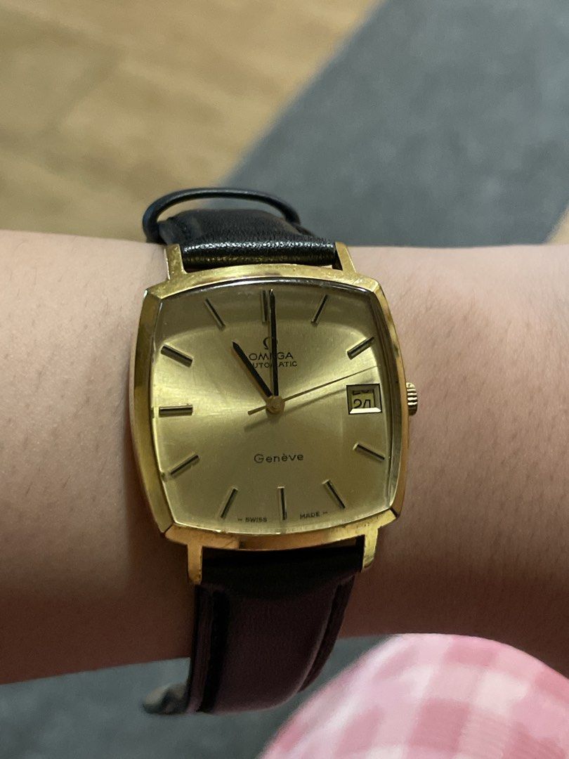 Omega Genève Automatic Gold Tone Watch (Category: Luxury Watches) located in Agdangan. Submitted by kikayfindsph (Listing ID 1448660419, Image 2). Description: - Vintage Omega Genève watch - Automatic movement with date function - Gold tone case and dial - Black leather strap - Runs well.